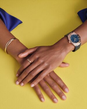 Naomie Harris Instagram - Things are brightening up with @omega and the iconic #omegaconstellation . Along with the sensational watch in blue, their 18K gold jewellery helps complete the look. #ad