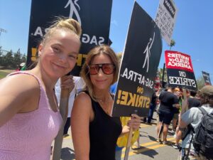 Natalie Zea Instagram - Two girls, who are exactly the same age, looking cute on a picket line. 🪧#unionstrong 
@vivian.olyphant