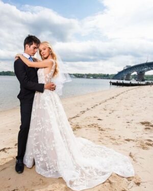 Natasha Henstridge Instagram - My son got married last week and what a special milestone it was! I could only post this picture of me with three chins because it encapsulates the incredible moment of pride and joy so well haha:) They got married on their own property. It was the most special, touching, healing, fun wedding. We all came together and laughed and cried and danced… Thanks to the Crywer family for having an awesome daughter and throwing a great party, thanks to all of the friends and family that flew in to celebrate such a beautiful occasion and lighting up the dance-floor 💃🕺🏼We’re so blessed.🥂🤍👰‍♀️🤵‍♂️ Big shout out to @cpixaperture for great photos and @phelony18 for officiating a beautiful service.Enrique for taking so many great pics as well! OMG the band!!!!