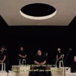 Netta Instagram – שמעתי מישהי אומרת שכל מי שהיה בישראל חווה תופת
פשוט יש כאלה שעדיין לא חזרו.
כל משפחה שכולה, כל משפחה שיש לה חטופים, עוד נמצאת עמוק בתוך התופת וצריך לעמוד לצדם.
ולזעוק את זעקתם.
הכל אפור ולא רלוונטי, הכל הבל הבלים עד שהחטופים לא חוזרים. 
אני מקדישה את הביצוע הזה לכל מי שעדיין נמצא בתוך התופת. 
הלוואי ויכולנו להוציא אתכם משם.

תודה לבן קירשנבאום ולאבשלום אריאל שהלכו עם החזון המוסיקלי שלי.
תודה לאחי הגדול זהר ברזילי, לטל כהן ולשרון פטרובר שבאו לרקוע להשבת החטופים
ותודה לאח הגדול של יותם – תובל 
יותם נחטף מביתו שבכפר עזה בבוקר יום שבת ומאז עולמו קפא. הוא בא לרקוע עבור אחיו מתוך ימי חושך מורטי עצבים.

פרויקט אור ראשון בא להקים מאגר מוזיקה מרפאת בתקופה החשוכה ביותר שידעה ישראל. כל הצוות הקדוש של ההקלטה, הצילום והיח״צ של הדבר הזה בא לעבוד בהתנדבות, זהו צוות מהמעלה הראשונה ואני מצדיעה לכם. האנשים האחרונים לחזור למעגל העבודה – רק כדי לקדם תרומות לארגון לתת שתומכת בניצולי המלחמה- לינק לתרומה בביו.

I heard someone saying that anyone who has been in Israel on october 7 has experienced hell. There are simply some who have not returned yet. Every family that has hostages is still deep in the dark and we need to stand by their side. And shout their cry. Everything is gray and irrelevant, all is vanity until the hostages return. All the women, men, children and elderly.
I dedicate this performance to everyone who is still living in hell. I wish we could get you out of there.

I want to thank Ben Kirshenbaum and Avshalom Ariel who walked with my musical vision. I want to thank my big brother Zohar Barzili, Tal Cohen, and Sharon Petruver who came to stomp to bring back the hostages. And I want to thank Tuval, Yotam’s big brother. 
Yotam was kidnapped from his home in Kfar Azza on a Saturday morning, and since then, his world has frozen. He came to stomp on behalf of his brother out of dark, nerve-wracking days.

The entire sacred team of recording, filming, and production of this came to work voluntarily. This is a top-notch team, and I salute you. The last people to return to the work circle – only to promote donations for the Latet Association, which supports war survivors.