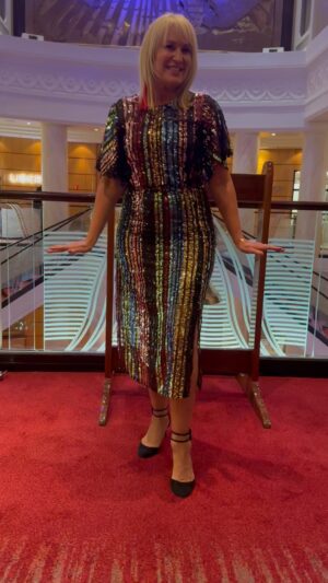 Nicki Chapman Instagram - All that glitters… 😉
Giving it my best shimmer on the Queen Mary 2 @cunardline 

Party frock @myleeneklass