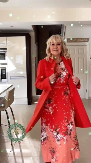 Nicki Chapman Instagram - They say bright is beautiful… sunglasses at the ready folks! 

Let’s take a moment please for the oldest coat in my wardrobe 😊 My 22 year old orange-red coat from @dkny & still going strong! 22 years together, isn’t that copper if we were married?! 🤣

Not sure many of you will have seen this one, I tend to keep it ‘for best’ which I always say NEVER DO!  Bought this whilst filming Pop Idol back in the day.  Glorious colour. Has a sixties vibe with panelling detail & same colour buttons. Worn with my ‘matching burnt orange/ red scheme’ @hobbslondon silk dress. As I feature coats through the year, not so much festive this one but uplifting 😊 added snowflakes for effect ❄️🙄🤣

NB little hand on coat fail at the end 🤣🤣🤣

What’s Chappers wearing on the 22nd Day of Coatmas? 

Coat @dkny 
Frock @hobbslondon 
Heels @thefoldlondon 

#whatschapperswearing
#25daysofCoatmas 

Locks & filming @hairbyninanikol