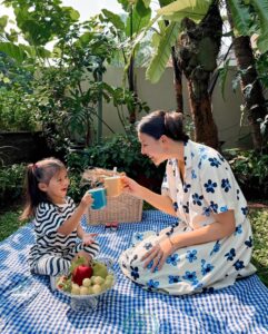 Nina Kozok Instagram - Unforgetable summer picnics with my little one. Wearing the limited edition collection by UNIQLO x Marimekko. Bold colors and motifs that are easy to mix and match. This collection launches today in all UNIQLO stores and online at UNIQLO.COM @uniqloindonesia #UNIQLOxMarimekko #UNIQLOIndonesia