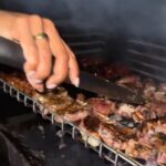Nyesha Arrington Instagram - POV: SOUTH AFRICAN BRAAI 🥩🔥🔥🔥 ...When you're invited over for a "Braai" and you end up with an apron on [wo]manning the grill! 👏🏾 aaand honestly... wouldn't have it any other waaayyy!! 🥩🔥🔥🔥 #braai #grilling #joburg #africa #cheflife . . In Africa, a braai is a barbecue or grill and is a social custom in Southern region of Africa. Many households use charcoal or wood... and traditional meats cooked include chicken, lamb chops, steak, and a variety of sausages that are generally enjoyed around a table and eaten straight from the grill with a white corn dense porridge like mixture call paap. That fermented hot sauce was one of the most delicious and spiciest things I've ever had in my life 🥵🤗 FUN FACT: If you didn't know what the tattoo on my fingers says it reads CHEF on the finger.. got it in 2009 when I lived in Maui 🤙🏾