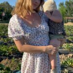Olesya Rulin Instagram - Strawberry kind of life 🍓 Wearing @christydawn. This is the BRYNNE dress in Cream Garden. Made from 100% regenerative cotton this dress is not only stunning but is actually changing the quality of the earth in which the cotton is grown. Making this dress more than sustainable. Head to @christydawn to learn more how you can become a land steward. I’m happy to share my code 15OLESYA for a little 🤍 from me to you.