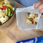 Omallys Hopper Instagram - If you’re looking for a quick and easy cleanup dinner idea, try this delicious Jalapeño Pineapple Salmon using @reynoldsbrands Baking and Cooking Paper. All you need is salmon and your favorite veggies, bake for 20 minutes and TaDAAAAA 🎉🎉 You’ve got dinner with #reynolds #ad