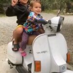 Orietta Berti Instagram - "Ginevra e Antonio anche loro fans di Orietta Berti e Fiorello. "Una Vespa in 2" " repost @giorgioriggio Grazie al caro Giorgio Riggio e ai suoi MERAVIGLIOSI nipotini Ginevra ed Antonio per questo omaggio...con la @vespa ❤🛵✌... Mi riempie il cuore di gioia vedere come #ladolcezzadeibambini❤ sia cosi contagiosa... "Una vespa in 2" @rosario_fiorello @bertiorietta Siete pronti alle sorprese di domani?😍 🛵❤💖💗💜🧡💛💚💙🌈 Un abbraccio💖 Orietta #ladolcezzadeibimbi❤️ #unavespain2 #UnaVespaInDue #lagiornatamondialedeibambini #PapaFrancesco #Fiorello #oriettaberti #estate #buonumore #UnFiore #summer #vivarai2 #unavespainduemania #love💖 @dan_e_dav @danti2f @enricocremonesiofficial @warnermusicitaly