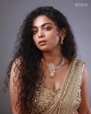 Padeni Kumar Instagram - Rise high like no one can reach you 🔥
.
Makeover : @makeupandhairbyrehana 
Wearing : @fatiz_official
Jewelry : @jjjewellerymart
Shot by : @redboxphotography
Concept & Styling : @makeoverbyimti
.
#portraits #photography #cinema #padinekumar #curly #love #eyes #makeup