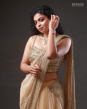 Padeni Kumar Instagram - Rise high like no one can reach you 🔥
.
Makeover : @makeupandhairbyrehana 
Wearing : @fatiz_official
Jewelry : @jjjewellerymart
Shot by : @redboxphotography
Concept & Styling : @makeoverbyimti
.
#portraits #photography #cinema #padinekumar #curly #love #eyes #makeup