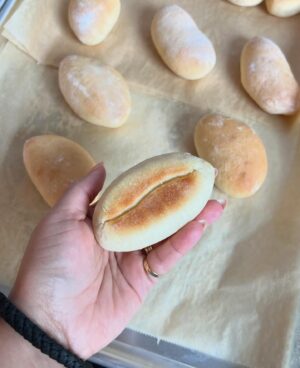 Paola Velez Instagram - Pan de agua (Dominican rolls) from Bodega Bakes — 
Taking a break from posting bodega bakes video because I lost my lil voice over the weekend. But that doesn’t mean that the BB content for my BB’s have to stop! 
—
If you’re from the Dominican Republic you know why I had to absolutely include this recipe. You can find them in the Collado, panadería, la sirena, but now you can find them in your very own kitchen! 

Eat them with queso de papa or with un cafecito del bueno. I can’t wait for you to bake these from the cookbook. 

—
Publishing October 1, available for preorder wherever fine books are sold 🫡✨
#dominicanbakes #bodegabakes #dominicanfood #pandeagua #pastrychef #dominicanchef #chefinspired #bronx #bronxny #dominicanrepublic🇩🇴 #bodega #cookbook #chefstyle #soignefood