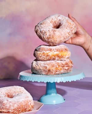 Paola Velez Instagram - Happy National DOÑA DONA day! 
(National donut day) 
To all who know and love her, yes she’s in the cookbook because I love yall! 

Have a lovely Friday 💜
Photo by @laurenviedallen for Bodega Bakes 

#nationaldonutday #donadona #bombesquad #bodegabakes