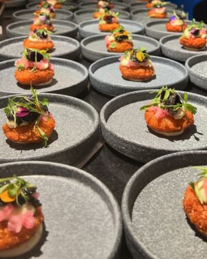 Paola Velez Instagram - Yuca & Caviar 
Crispy yuca fritter, lemon crema, pickled onion & cilantro