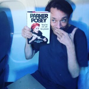 Parker Posey Instagram - @chriskattanofficial Chris Kattan reads about himself in my book#youreonanairplane. He wishes his part was bigger but he’s cool with it.😜