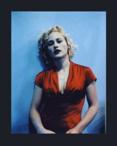 Patricia Arquette Instagram - The red dress . The blue wall #Flashback