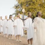 Patrisse Cullors Instagram - Whenever I’m in deep grief or need to remind myself where I come from I pray to the orisha. This past month has been an exercise in holding grief while taking action. This is an exercise I’m deeply experienced in. I don’t find it coincidental that last weekend was the opening of @fowlermuseum The House Was Too Small exhibition. My work ‘Free Us’ is featured and up until June 2nd. It’s an opportunity for the world to not only experience the objects of Yorubaland but also bear witness to the way our people pray. The way we hold grief. The way we activate resistance. When I say there was an entire village who helped build out this body of work of mine, it took an entire village. My ancestors and Olodumare. The entire orisha pantheon. Dafa, odu, and ebo. I want to thank the entire @fowlermuseum team and especially Erica Jones the curator of African arts for being some of the best people to work with. Thank you @maxwelladdae and @samchatterjee for the beautiful visual short you brought to life. Thank you @whitneyskauge for capturing all the BTS for the stunning images you saw and witnessed and shared with all of us. Thank you @kutula for being my ace in all of this performance work. For fabricating and co designing these beautiful crowns for Oya, Obatala, Oshun and Yemaya. Thank you to @_twiintowers_ for the beautiful and epic soundscape you created for the altar room. Thank you @metabolicstudio for supporting this exhibition! Thank you to the gorgeous and powerful #BlackFemmes who walked with me. A mindfulness moment to hold the space for us all. The way Black women do. @kingavriel @beingxiana @cindybonaparte @liliana.jeanine @ladyblake23 @autumnbreon @luxngrace Thank you @norblacknorwhite and @mayameyershop for our opening ritual garments for Ori Whispers. Thank you @nyasha_bm and @nurturednaturalhair for the care around our Ori. Your magic hands were felt. And thank you to our hair sponsor @rebundle.co. This space is a sacred space for all to receive the kind of love and care we all deserve. Come and be present for yourselves and the orisha. Give space to challenge Christian Supremacy. Ashe ooooo