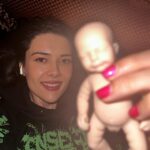 Patti Harrison Instagram - If given the chance i think id be a good mom because id hold the baby like this. And when people in public would yell at me for holding it this way, id say “im so sorry. This better?” Then I’d hold it the right way …and everyone would smile 😊 (P.S- she is awake in these photos! I had her close her eyes for the flash 😌)