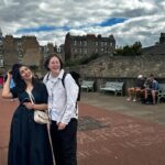 Patti Harrison Instagram - Edinburgh photo dump: 1. A photo of me. 2. Forcing two “awkward turtles” to have a kiss 3. @theamyannette giving thanks to god (Christian). 4. @abcelya getting a massage at a store. 5. Trying to take a photo of myself with Arthur’s Seat and winning like a bad bitch: non-committal! 6. Celya and @chloepetts laughing at something that had happened or was said. 7. @gertiebird laughing at something that had happened or was said. 8. Amy Annette giving thanks to god* again. (*christian) 9. Greta & myself outside. She is giving thanks (to god) 10. Trying to get a video of @mrnishkumar ‘s broken finger for my spank b*nk.