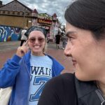Patti Harrison Instagram - Edinburgh photo dump: 1. A photo of me. 2. Forcing two “awkward turtles” to have a kiss 3. @theamyannette giving thanks to god (Christian). 4. @abcelya getting a massage at a store. 5. Trying to take a photo of myself with Arthur’s Seat and winning like a bad bitch: non-committal! 6. Celya and @chloepetts laughing at something that had happened or was said. 7. @gertiebird laughing at something that had happened or was said. 8. Amy Annette giving thanks to god* again. (*christian) 9. Greta & myself outside. She is giving thanks (to god) 10. Trying to get a video of @mrnishkumar ‘s broken finger for my spank b*nk.
