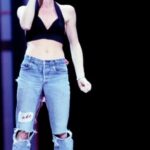 Peaches Instagram - Unmatched talent Unchartered courage We, as a society, cancelled you when we should have listened, acted, and celebrated you. So many feelings You’ve giving me so much to protest, to strive for, and to grow from I love you Sinéad! This clip - She is 21 This was her first album Nominated for a Grammy for best rock vocal performance alongside Tina Turner and Pat Benatar. She gave no fucks. Entering on stage with no visible band wearing only a black sports bra and jeans. Singing about the rituals of female circumcision. She smashed it! Additional info via @bigbadflowerchild She tied the arms of a baby's onesie, worn by her then-young son Jake, onto the belt loops of her jeans, letting it flap around her waist as she sang. O'Connor later put the onesie on her mother's grave, intending it as a "souvenir for her from the Grammys." The writer Allyson McCabe also called the wardrobe choice "a middle finger to the executives at her record label who had warned her that motherhood and a career were incompatible." O'Connor topped off her outfit by painting Public Enemy's yellow and black bullseye logo on the left side of her head-effectively giving the group, and the entire genre of hip-hop, a prominent place on network TV. In Nothing Compares, Chuck D called her gesture of solidarity "admirable" and added, "With Sinead O'Connor, you didn't get the sense that she was just being pretentious or that she was fake. It was like, she seriously has issues with this. Cc: https://www.thedailybeast.com/the-rebellion-of-sinead-oconnors-1989-grammy-performance