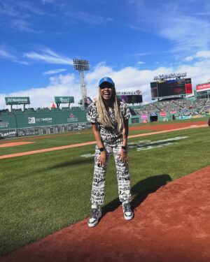 Phoebe Robinson Instagram - I CAN. FUCKING. DO. ANYTHING. I started running last March as a new hobby. Fell in love with it. Did some races. And last September, (RED) asked me to run this race for them. And I did it! Wow. Surprising yourself is the coolest thing! Cannot wait to do another marathon! 

Running the @bostonmarathon with a chest cold is a specific kind of masochistic hell. 10 out of 10 do not recommend. Haha. But for real, the race was a surreal, incredible, once in a lifetime experience. No matter how much you prep, train, when it’s race day, you just have to meet the moment & see what you’re really made of. I saw ppl vomiting, limping, struggling; my parents lost count of how many people they saw pass out at or near the finish line. The Boston Marathon is a beast like no other and sick or not, I refused to give up.

1) Post race right after I go my medal, my dad took this photo. I was so happy, tired, and proud of myself. Baby is a marathoner!
2) On Saturday, @bankofamerica invited me and the rest of Team (RED) to a Red Sox game and I got to represent (RED) on the field during special recognition before the game started. Jumpsuit: @wearewildfang 
3) Team @red - @dan_churchill, @jeffreymce, @bellezel & I - got to pose with the World Champion trophy. Neat!
4) My parents showed up looking fly AF in their matching Boston Marathon jackets that I got them. 🥰🥰
5) (RED) gang pre-race.
6) Me right before getting my marathon cherry popped.
7) Saw so many great signs thruout the race. This made me stop and laugh so hard.
8) Heartbreak Hill was no joke. Truly was hard. About 13 miles into the marathon, it felt like someone was pressing down/sitting on my chest, but I remained calm and stuck to my plan: running up HH, which was between miles 20 and 21 and lasted 1/2 mile, without stopping. And I did it!
9) This was towards the end. I was fighting for my life for the last 4 miles. I told myself to keep moving. Never stop. And remember my why: I’m doing this for (RED). It’s bigger than me. But also: this IS for me. To test myself mentally and physically.
10) My dad took the photo. He tidied up all the tables behind me because they were messy with food. #DadsOfInstagram #BostonMarathon
