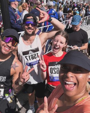 Phoebe Robinson Instagram - I CAN. FUCKING. DO. ANYTHING. I started running last March as a new hobby. Fell in love with it. Did some races. And last September, (RED) asked me to run this race for them. And I did it! Wow. Surprising yourself is the coolest thing! Cannot wait to do another marathon! 

Running the @bostonmarathon with a chest cold is a specific kind of masochistic hell. 10 out of 10 do not recommend. Haha. But for real, the race was a surreal, incredible, once in a lifetime experience. No matter how much you prep, train, when it’s race day, you just have to meet the moment & see what you’re really made of. I saw ppl vomiting, limping, struggling; my parents lost count of how many people they saw pass out at or near the finish line. The Boston Marathon is a beast like no other and sick or not, I refused to give up.

1) Post race right after I go my medal, my dad took this photo. I was so happy, tired, and proud of myself. Baby is a marathoner!
2) On Saturday, @bankofamerica invited me and the rest of Team (RED) to a Red Sox game and I got to represent (RED) on the field during special recognition before the game started. Jumpsuit: @wearewildfang 
3) Team @red - @dan_churchill, @jeffreymce, @bellezel & I - got to pose with the World Champion trophy. Neat!
4) My parents showed up looking fly AF in their matching Boston Marathon jackets that I got them. 🥰🥰
5) (RED) gang pre-race.
6) Me right before getting my marathon cherry popped.
7) Saw so many great signs thruout the race. This made me stop and laugh so hard.
8) Heartbreak Hill was no joke. Truly was hard. About 13 miles into the marathon, it felt like someone was pressing down/sitting on my chest, but I remained calm and stuck to my plan: running up HH, which was between miles 20 and 21 and lasted 1/2 mile, without stopping. And I did it!
9) This was towards the end. I was fighting for my life for the last 4 miles. I told myself to keep moving. Never stop. And remember my why: I’m doing this for (RED). It’s bigger than me. But also: this IS for me. To test myself mentally and physically.
10) My dad took the photo. He tidied up all the tables behind me because they were messy with food. #DadsOfInstagram #BostonMarathon