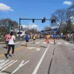 Phoebe Robinson Instagram - I CAN. FUCKING. DO. ANYTHING. I started running last March as a new hobby. Fell in love with it. Did some races. And last September, (RED) asked me to run this race for them. And I did it! Wow. Surprising yourself is the coolest thing! Cannot wait to do another marathon! Running the @bostonmarathon with a chest cold is a specific kind of masochistic hell. 10 out of 10 do not recommend. Haha. But for real, the race was a surreal, incredible, once in a lifetime experience. No matter how much you prep, train, when it’s race day, you just have to meet the moment & see what you’re really made of. I saw ppl vomiting, limping, struggling; my parents lost count of how many people they saw pass out at or near the finish line. The Boston Marathon is a beast like no other and sick or not, I refused to give up. 1) Post race right after I go my medal, my dad took this photo. I was so happy, tired, and proud of myself. Baby is a marathoner! 2) On Saturday, @bankofamerica invited me and the rest of Team (RED) to a Red Sox game and I got to represent (RED) on the field during special recognition before the game started. Jumpsuit: @wearewildfang 3) Team @red - @dan_churchill, @jeffreymce, @bellezel & I - got to pose with the World Champion trophy. Neat! 4) My parents showed up looking fly AF in their matching Boston Marathon jackets that I got them. 🥰🥰 5) (RED) gang pre-race. 6) Me right before getting my marathon cherry popped. 7) Saw so many great signs thruout the race. This made me stop and laugh so hard. 8) Heartbreak Hill was no joke. Truly was hard. About 13 miles into the marathon, it felt like someone was pressing down/sitting on my chest, but I remained calm and stuck to my plan: running up HH, which was between miles 20 and 21 and lasted 1/2 mile, without stopping. And I did it! 9) This was towards the end. I was fighting for my life for the last 4 miles. I told myself to keep moving. Never stop. And remember my why: I’m doing this for (RED). It’s bigger than me. But also: this IS for me. To test myself mentally and physically. 10) My dad took the photo. He tidied up all the tables behind me because they were messy with food. #DadsOfInstagram #BostonMarathon