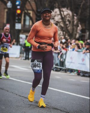Phoebe Robinson Instagram - I CAN. FUCKING. DO. ANYTHING. I started running last March as a new hobby. Fell in love with it. Did some races. And last September, (RED) asked me to run this race for them. And I did it! Wow. Surprising yourself is the coolest thing! Cannot wait to do another marathon! 

Running the @bostonmarathon with a chest cold is a specific kind of masochistic hell. 10 out of 10 do not recommend. Haha. But for real, the race was a surreal, incredible, once in a lifetime experience. No matter how much you prep, train, when it’s race day, you just have to meet the moment & see what you’re really made of. I saw ppl vomiting, limping, struggling; my parents lost count of how many people they saw pass out at or near the finish line. The Boston Marathon is a beast like no other and sick or not, I refused to give up.

1) Post race right after I go my medal, my dad took this photo. I was so happy, tired, and proud of myself. Baby is a marathoner!
2) On Saturday, @bankofamerica invited me and the rest of Team (RED) to a Red Sox game and I got to represent (RED) on the field during special recognition before the game started. Jumpsuit: @wearewildfang 
3) Team @red - @dan_churchill, @jeffreymce, @bellezel & I - got to pose with the World Champion trophy. Neat!
4) My parents showed up looking fly AF in their matching Boston Marathon jackets that I got them. 🥰🥰
5) (RED) gang pre-race.
6) Me right before getting my marathon cherry popped.
7) Saw so many great signs thruout the race. This made me stop and laugh so hard.
8) Heartbreak Hill was no joke. Truly was hard. About 13 miles into the marathon, it felt like someone was pressing down/sitting on my chest, but I remained calm and stuck to my plan: running up HH, which was between miles 20 and 21 and lasted 1/2 mile, without stopping. And I did it!
9) This was towards the end. I was fighting for my life for the last 4 miles. I told myself to keep moving. Never stop. And remember my why: I’m doing this for (RED). It’s bigger than me. But also: this IS for me. To test myself mentally and physically.
10) My dad took the photo. He tidied up all the tables behind me because they were messy with food. #DadsOfInstagram #BostonMarathon