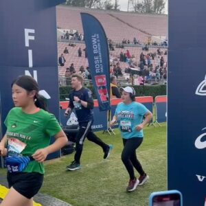 Phoebe Robinson Instagram - Not even this goofy ass bitch stepping into the shot when she saw I was getting my picture taken can take away from the fact that I ran my first ever half marathon today! 🤣🤣🤣🤣#RoseBowlHalfMarathon is NO JOKE! Good amount of hills. Tested my mental strength. But I never wanted to quit. I knew it was gonna be worth it! Just had to push thru. Especially when I was fighting for my life at mile 10. Phil Collins “In the Air Tonight” got me together so well, I listened to it twice in a row. Then at mile 12 when I was really fighting for my like Whitney Houston’s “I’m Every Woman” carried me thru. Thanks, @mrshanlui, for running with me! She def finished before me, but it was so nice knowing she was gonna be there waiting for me at the finish line. Next up: Central Park Half Marathon in Feb 25th. Until then, I’m going to be wearing this medal all day like an obnoxious asshole. YOU WILL GET SICK OF ME AND IONNO CARE. 🤣🤣🤣