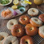 Poh Ling Yeow Instagram - 🥯 I’ve been craving homemade bagels for weeks! The recipe will tolerate up to 1 cup of sumthin’ sumthin’ - blueberries, choc chips etc. Also, in case u might ask - Skeleton & goldfish bowl is thrown & glazed by @graemerichardson67 , painted by me. Jamface tea towel designed by @sweetpetite77 but no longer available - sorry 😢. 2 tsp (7g) yeast 2 Tbs honey 2/3 cup tepid milk 3 cups plain bread flour (normal plain flour works but texture won’t be as chewy) 1 cup plain wholemeal flour 1 tsp salt 1 - 1 1/3 cup tepid water 1 egg, whisked 1/3 cup sesame or poppy seeds or sea salt Mash yeast & honey together. Add milk and stir to dissolve. Cover & rest for 20 mins or until surface is foamy. Combine the flours, salt, yeast honey milk mix & only 2/3 of the water. Knead into a pliable dough adding the remaining water if needed. The dough should knead easily & should not stick to the bench surface even without the aid of flour. Cover with damp tea towel to rise until double its original size in a warm draught free spot. Punch down dough and cut into 10 even pieces. Roll each piece into a 2cm wide sausage. Squash down one tip, bring the other tip to sit on the flattened tip and form a ring. Pinch around it to secure (see reel if unsure). Flip it over and rest on a 10x10cm square of baking paper. Repeat until all the rings are formed. Cover with a damp tea towel and allow to double in size again in a warm, draught free spot. Preheat oven to 170*C FF. Boil the bagels in plenty of water (about 30 secs each side). Rest on a clean tea towel to absorb excess water. Transfer to baking trays lined with baking paper leaving a 2cm space between the bagels. Baste generously with the egg. Sprinkle or dip in seed of choice. Bake for about 20 mins or until golden and fill with whatever your heart desires! Enjoy and oh, these freeze well in an airtight container or snap lock bag ♥️ PS Quick cucumber pickle is simply shaved crunchy part of 1 continental cuke, 1 tsp salt, 2 Tbs sugar, splash of white wine or cider vinegar. Taste then feel free to play with the balance for a sweeter, saltier or more sharp finish.