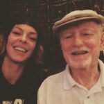Pollyanna McIntosh Instagram - We laughed together a LOT, sometimes deliriously, like that time in the middle of the night at Sundance, representing 5,6 films, maybe more, huddled over our laptops, working like thieves but suddenly up doing totally inappropriate impressions of someone we liked but were unable to stop choke laughing about how they looked in their ski jacket, panicking about their film. We ate together a LOT. Salt’s Cure; Musso’s; the chicken Milanese and a martini at Arclight after a good movie, your back yard, later Morton’s by your new spot. Your capacity for ENJOYMENT was WONDERFUL. You bought me my first tasting menu at The George for my birthday during SXSW. So generous. And when I finally had payola you wanted to try Providence. Wow! That meal! We oohed and aaahd over it all. Playful place. “The sommelier is not a snob at all!” You were delighted. You taught me so much about food and wine and side cars and oysters and all sorts. The staff had better know what’s up. You brought your own fine napkins if things weren’t up to scratch. You were always educating, improving; sometimes someone was bold enough to give you the old side eye, sometimes it was me. We worked together, we played together. I always wanted to bring boyfriends over to meet you. You didn’t always approve of my boyfriends. You could never understand “Why do straight people have to be so REGULAR about their relationships?!” I trimmed your nose and ear hair after the stroke, cut your nails, cleaned out your ears. You were no friend to shame. Onwards! Thank you to @mptf for taking care of you. Love to all out there grieving Mickey’s loss. I have missed you and do still. I bet you’re dancing your tits off in heaven with a hot hunk in an angel costume. ❤️❤️❤️👊👊👊🙌🧡🧡🧡 #mickeycottrell #RIP