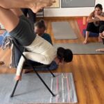 Poppy Jabbal Instagram - This song is a dedication to this chair ..... which made me move and how #yoga #flexibility #workout #fun #stretching