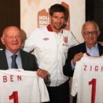 Rachel Riley Instagram - Today on Holocaust Memorial Day I want to pay tribute to two wonderful men I have the privilege of meeting while they were alive, who we’ve sadly lost in this last year. Zigi Shipper BEM and Sir Ben Helfgott were born in Poland and as children, lost most of their extended families as part of the systematic murder of 6 million Jewish men, women and children in the Holocaust. Sir Ben spent his youth as a slave labourer, in ghettos and concentration camps and saw unimaginable horrors. The story of his arrival in England after liberation has been immortalised as part of the story told in the BBC movie, ‘The Windermere Children’. Sir Ben overcame so much adversity to become the captain of British weightlifting team and won a bronze medal in the 1960s Olympics. He did decades of charity work, supporting fellow survivors and educating the public on the dangers of extremism and hate going unchecked. Zigi’s childhood was spent in the Lodz ghetto, at several concentration camps including Auschwitz-Birkenau, and he survived a Nazi death march before being liberated. He came to England to join his mother, after his grandparents and father who he’d previously lived with had died or where never heard of again. Zigi too dedicated many decades educating young people about what happened in this awful period of history, and even though he suffered so much in his life, he still had such an infectious personality and was an absolute joy to be around. He too has been immortalised as King Charles (then The Prince of Wales) commissioned the portraits of seven Holocaust survivors, of whom Zigi was one, and so Zigi’s face hangs on the walls of Buckingham Palace today. Sir Ben and Zigi were great lifelong friends, great advocates for @holocaustuk and are missed by so many in the wider community. You can read more about them here. https://www.hmd.org.uk/resource/sir-ben-helfgott/ https://www.hmd.org.uk/resource/zigi-shipper-hmd-2017/ May their memories be a blessing. #Holocaust #HolocaustMemorialDay #HMD #HMD2024