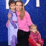Rachel Riley Instagram - Hola! Shalom! Salaam! - one of the first lines in the gorgeous new Disney movie - Wish 🌟 Took the girls for their first ever trip to the cinema and what a lovely experience it was. The film is a new instant classic in my book, enjoyed the girls sitting on my lap during the scary bits, wagging their fingers saying, “naughty, naughty King” 😂 I’m glad we’re in the Disney age with them now, can’t wait till they’re old enough for the parks. We enjoyed the Disney 100 exhibition together a few weeks back too, although I probably would have enjoyed it more without them and actually being able to listen to and read the displays (sorry girls!). Thanks too for the purple Asha costume that was #gifted to Mave, lots of little girls will enjoy dressing up as her for years to come I’m sure. #premiere #wish #disney #asha #disney100