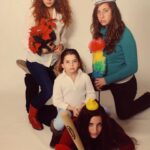 Rachelle Lefevre Instagram - Anyone else’s family go for holiday portraits? My sister’s and I had a different take. And yes, that’s a glass of milk my sister Miriam is holding, don’t even know where she got it. 🤷‍♀️ #flashback #familyportrait #sistersquad #sisters