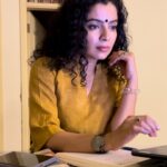 Ranjitha Menon Instagram - Torn between Duty and Delight. The Dilemma of Work and a Good Book! #candid #moments #truetomyself #worktime #writingmode