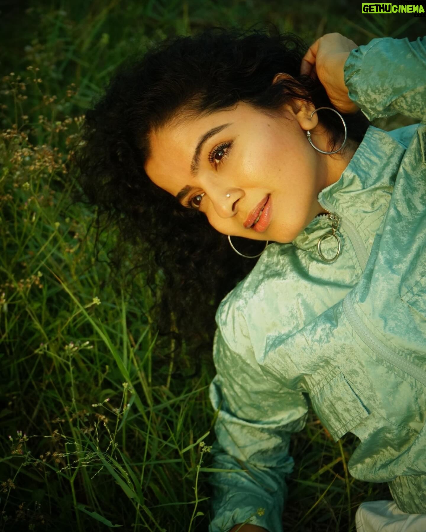 Ranjitha Menon Instagram - Infused with the scent of earth and life! Immersed in the embrace of nature’s green hue! With every touch, she connects with the soil beneath her, feeling the cool blades of grass caress her skin, grounding her in the present moment, away from the worries of yesterday and uncertainties of tomorrow. #earth #nature #solace #life #green 📷 @arunchandu