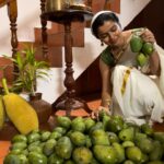 Ranjitha Menon Instagram - വിഷുക്കാലം! എല്ലാവർക്കും സമൃദ്ധിയും സന്തോഷവും നേരുന്നു! 💛 ഫോട്ടോ കടപ്പാട്: അമ്മയോട് As we celebrate this festival of abundance, let us pause and express our heartfelt gratitude to Mother Earth in providing for us! #vishu #abundance #festival #feast #happiness #homely #rawpics #joyful #moments #tradition #organicgardening #fruits #mangoes #jackfruit #from #backyard #mobilephotography #realmoments #photooftheday