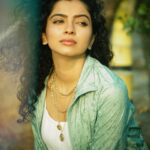 Ranjitha Menon Instagram - Infused with the scent of earth and life! Immersed in the embrace of nature’s green hue! With every touch, she connects with the soil beneath her, feeling the cool blades of grass caress her skin, grounding her in the present moment, away from the worries of yesterday and uncertainties of tomorrow. #earth #nature #solace #life #green 📷 @arunchandu