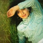 Ranjitha Menon Instagram - Infused with the scent of earth and life! Immersed in the embrace of nature’s green hue! With every touch, she connects with the soil beneath her, feeling the cool blades of grass caress her skin, grounding her in the present moment, away from the worries of yesterday and uncertainties of tomorrow. #earth #nature #solace #life #green 📷 @arunchandu