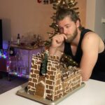 Rebecca Breeds Instagram - When you can’t get home for Christmas, you fill that whole in your heart with Gingerbread! I made a replica of the old Stable in our back yard, while Luke made Winterfell… (post Ramsey sacking)……. Very proud to say I made marzipan from scratch for the first time. Needs must. Oh - and sugar work!! Look out @bakewithrahul 💃🎄✨