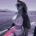 Rhian Sugden Instagram - At no point did he mention that I’m walking around looking like Elton John. (The glasses are pink and blue). Cheers @opmellor 🥲😂 #greece #santorini #🇬🇷 #goodbyeyellowbrickroad Undies are from my fave @playfulpromises Kaftan: @reiss Glasses: Need to go