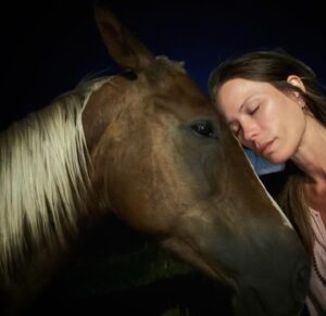 Rhona Mitra Instagram - An invitation into their dreams, under a carpet of the all-knowing, twinkling eyes….
is their gentle way of saying..
thank you….

18 days safe 

#Balthazar
To the animals may we be forgiven 

#BeingWithHorses #Family #LivingWithUnicorns #Orphanage #FreeRoaming #RewildRememberRehabilitate 
#CertifiedHorseSunggler #ChampionCuddler #WinningMedals
🥇 
@thelastarkorphanage 
#MumsGarden #Infirmary