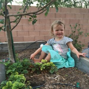 Robyn Brown Instagram - Found my little pretty princess eating strawberries out of my strawberry patch.  She loves them and will meticulously look through the leaves to find them.  #summerfun #ilovebeingamom #awonderfullife #sweetandsassy
