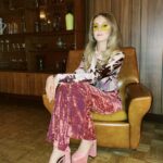 Rose Ayling-Ellis Instagram - I can’t get over @rickyandthe64 awesome work on my hair 💇‍♀️ I can’t get over how beautiful @tobileigh__ look for her birthday 🪩 I can’t get over how cool this venue is 🕺🏼💃🏼 I think I will never get bored of 70s fashion… But I don’t think I would be wearing pink velvet flare trousers anytime soon 😂 What fashion trends you followed that now make you cringe? Mine is blue mascara and straightener my side fringe into A4 sheet… 😳