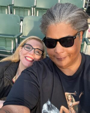 Roxane Gay Instagram - Three years ago today, @debbiemillman and I eloped. It was an amazing day but in truth, every day with Debbie is amazing in one way or another. She has an irrepressible sense of adventure, a brilliant mind, a beautiful smile, and a loving heart. She loves to sing and dance and wear hats. She has a canonical knowledge of hip hop which still amazes me. She is fiercely loyal, honest, and mega hot. She loves animals and they love her back. I could go on but I won’t! Happy anniversary, @debbiemillman.