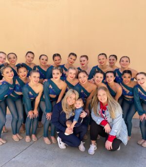 Sabrina Bryan Instagram - This season has a little extra sparkle dust for this momma bear! So happy to be back to watch my girls light the floor up in person and have our little Mustang Mascot right next to me! 🥰💙🎶❤️ #mustangpride #comilliamonroe