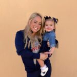 Sabrina Bryan Instagram - This season has a little extra sparkle dust for this momma bear! So happy to be back to watch my girls light the floor up in person and have our little Mustang Mascot right next to me! 🥰💙🎶❤️ #mustangpride #comilliamonroe