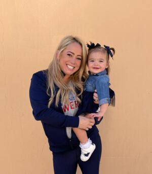 Sabrina Bryan Instagram - This season has a little extra sparkle dust for this momma bear! So happy to be back to watch my girls light the floor up in person and have our little Mustang Mascot right next to me! 🥰💙🎶❤️ #mustangpride #comilliamonroe