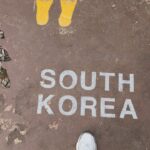 Sahiba Bali Instagram - Crash landed on you 🇰🇵 Dint get a chance to upload this before but Oct’23 we went to the demilitarised zone of North Korea with South. the land that Ive read about, the nation I’ve seen in documentaries, the unknown territory suddenly was in front of me. I cant explain the goosebumps I had when I saw a few locals through a telescope riding a bike deep within the city, the chills I got when I witnessed #DPRK - cant describe the feeling of being in the most shielded country in the world and yet being so far. How can our worlds be so different? #NorthKorea #DMZ