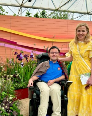 Sally Phillips Instagram - The winners of #rhschelseaflowershow are announced tomorrow but I got a sneak peak at the contenders today thanks to the excellent Gardens for Good- check them out on @project.giving.back #gardensforgoodcauses.  Such a great day, lucky me. And so nice to hang out with funny doctor @michaelakadiri funny queen @elliejanetaylor dramatically skilled baker and seamstress #janeasher and Oscar nominee of the future @fehintibalogun. Also hilarious.

Project Giving Back was founded by two philanthropists who had the idea of giving the significant platform (and springboard) of a Chelsea Flower Show garden to community interest groups, educational organisations and charities within the UK so they can raise awareness and engage with their audience. Hard to believe now but all the Chelsea gardens used to be put in a skip once the week was up. All of these gardens are repurposed or relocated to a permanent home afterwards - going out when the flower show is over to schools, hospitals, therapeutic settings and community spaces so they have a long-lasting legacy.
A feast for the eyes but also the heart. Loved meeting Jessie and @officialdanielwakeford at @pulpfrictioncic Growing Skills Garden and Adil and the kids at @panathlon_international Joy Garden.
Thought of @darrenashton and all you great #survivors in the @bowelresearchuk Microbione garden - a meadow of edible flowers complete with dormouse nest and cracked hazelnut shells designed by @chrishullgardens and @sidhillecogardens . @nationalautisticsociety garden featured giant marble run, @musculardystrophyuk a beautiful haven, but was stopped in my tracks by the @freedomfromtorture Garden : A Sanctuary for Survivors by @johnwarland and @emmaoconnellgardendesign .
 Thanks to @annie_miall as per, to @cefinnstudio for the loan of the beautiful yellow frock which I am definitely going to buy and to @aspinaloflondon for the bag. Hair and make-up by.,, whoops should probably have got help with that.